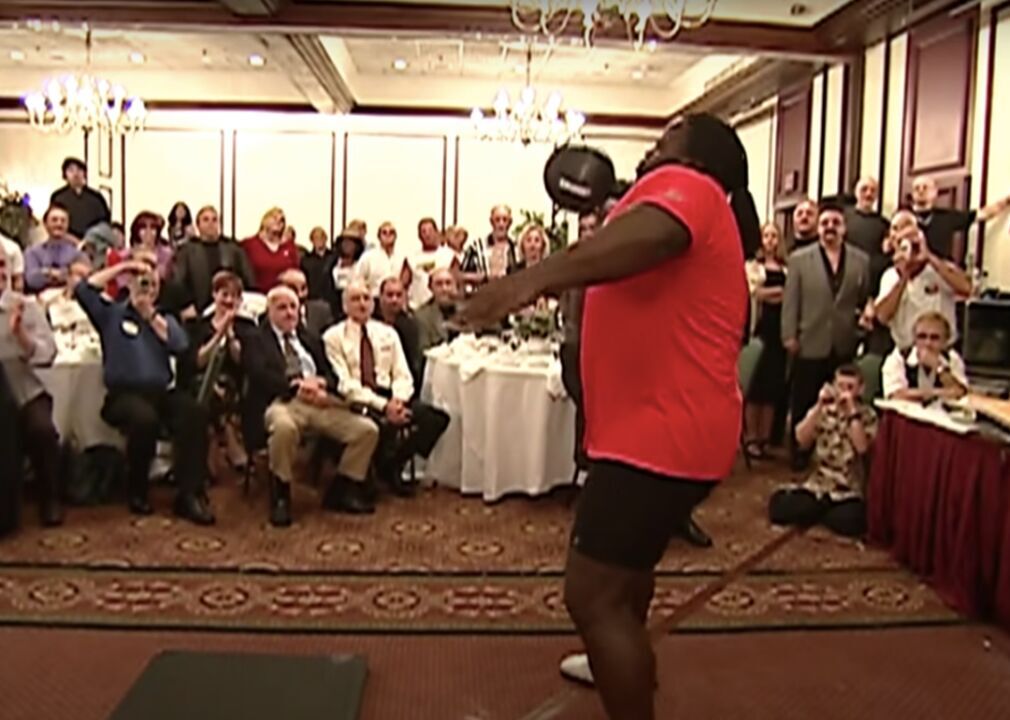 2002: Mark Henry lifts Thomas Inch dumbbell